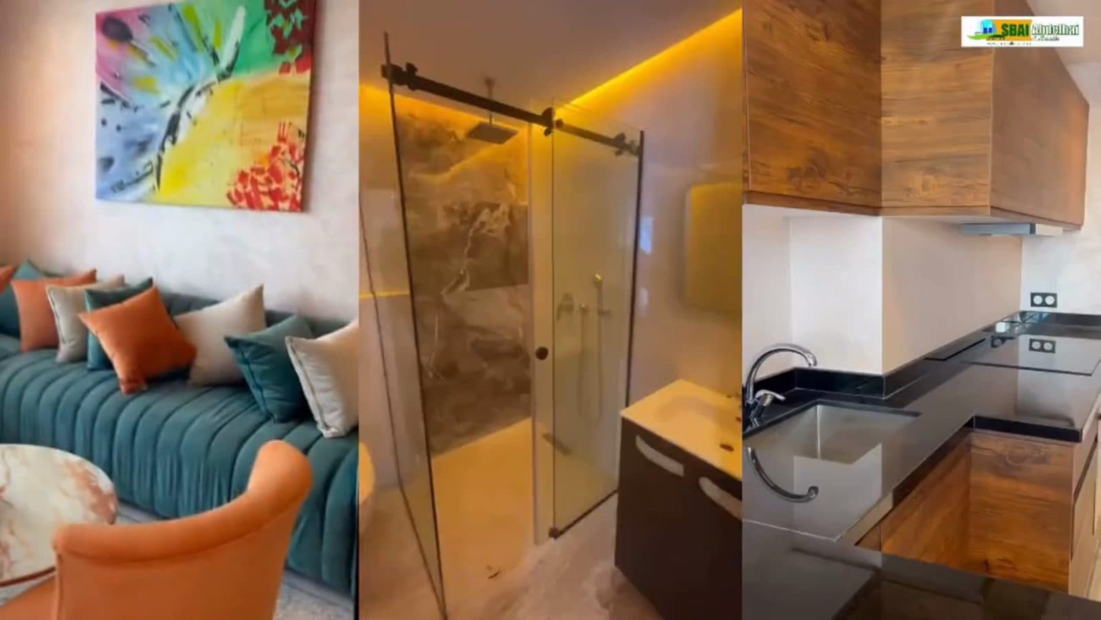 Séjour de l'appartement témoin, canapé et cuisine ouverte